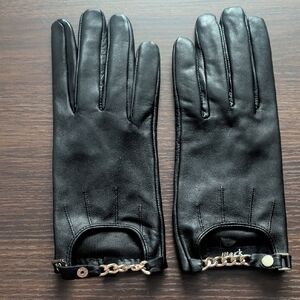mark. Black Leather Gloves with Gold Chain Accents